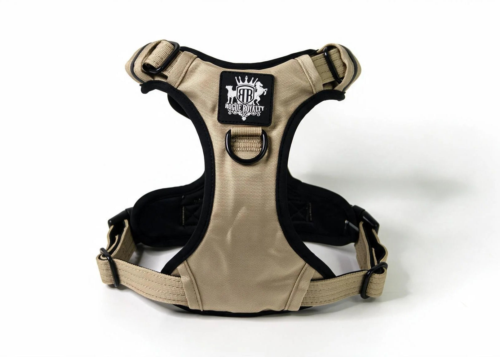 A tan and black Rogue Royalty dog harness with a black brand patch on the chest, displayed on a clean white background.
