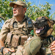 Belgian Malinois with Conservation ranger in Krguer national park on patroil with SupaTuff Camoflague tactical dog harness.