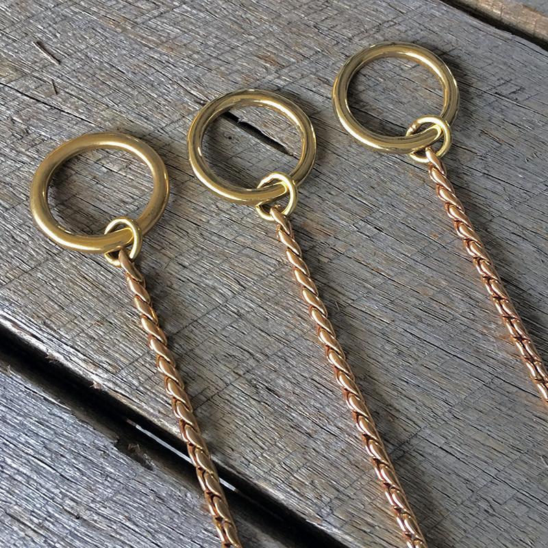 O ring of brass slip dog training chain collars. aid