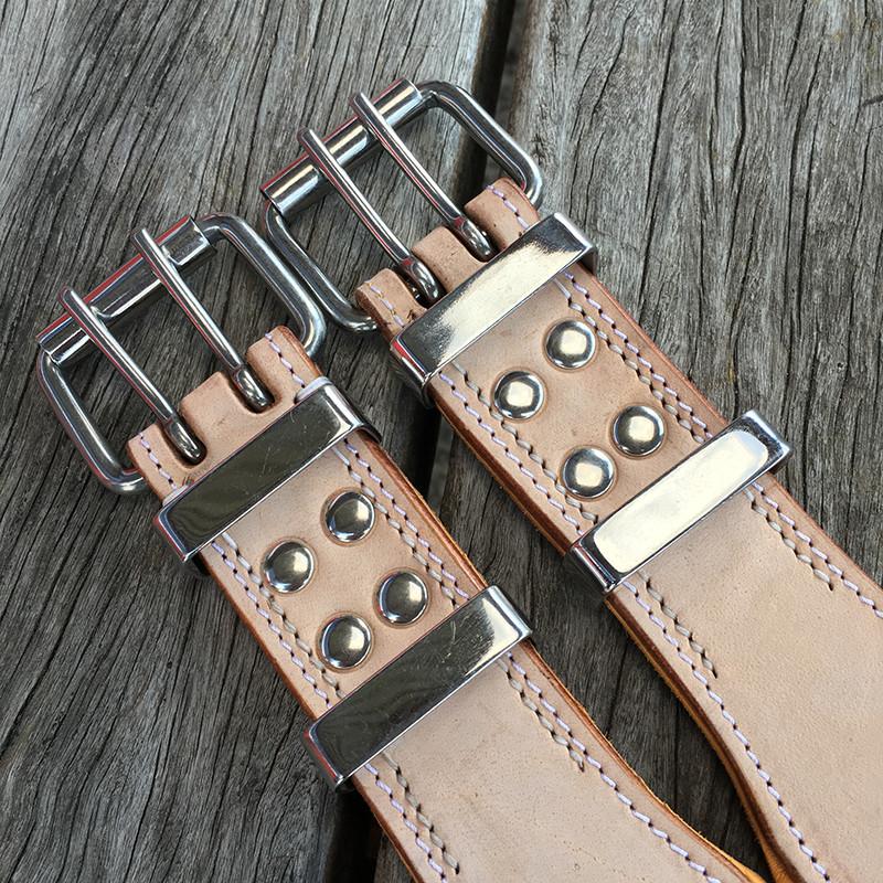Top view of stainless steel roller buckles on buckskin leather dog collar
