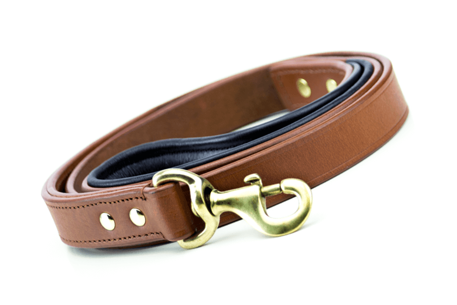 Side view of handmade brown leather dog leash with brass fittings, brass latch.