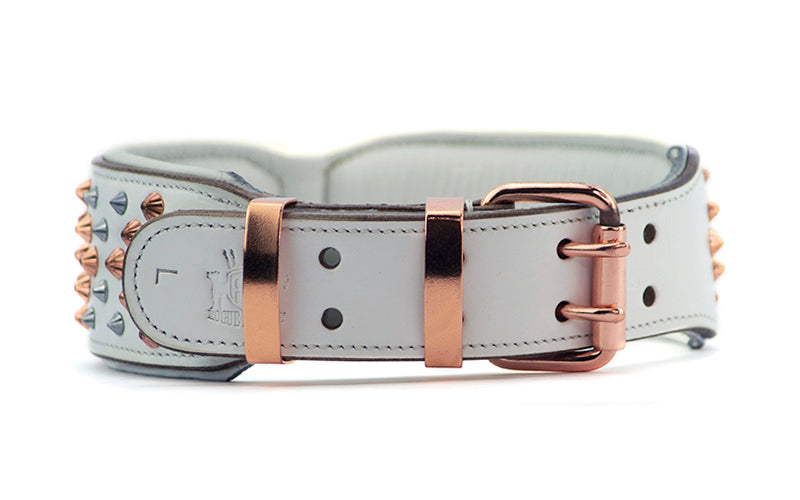 Luxury designer leather dog collar made from white leather , rose gold and chrome metal fittings. Rose gold double pin buckle for safety and strength for large dogs.
